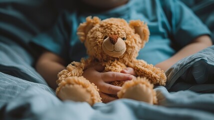Little hand holding teddy bear, comfort in hospital, close up, symbol of bravery, warm hues 