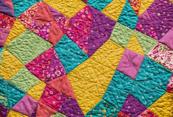 Handmade patchwork quilt with a mix of floral and geometric patterns in vivid colors. AI generated.