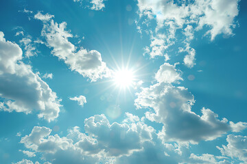 Sunlight breaking through scattered clouds on a clear blue sky during midday