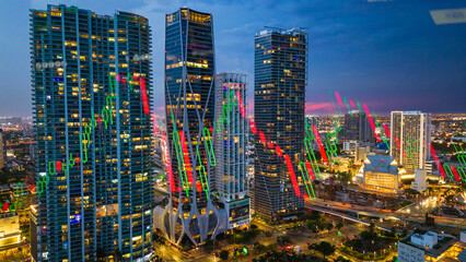 stock market chart analysis on modern cityscape skyline illuminated at night 