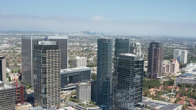 Birds eye view of Century City downtown and Los Angeles California skyline sunny