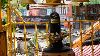a figurine of shivling in temple