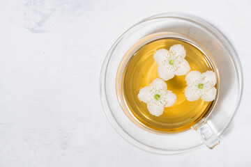 cup of fresh fragrant green tea with jasmine