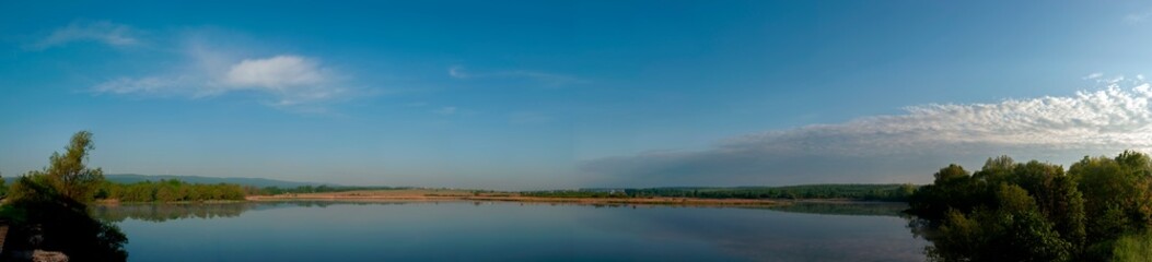 Panorama lake view in sunrise time .Sunrise at the lake