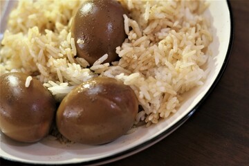 Rice with stewed egg curry