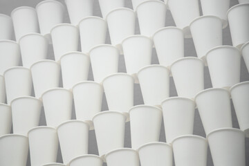 Fototapeta premium white paper cups on the gray background . soft focus