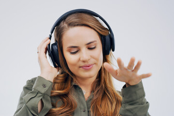 Woman, studio or dancing with headphones and hand for subscription, streaming or music with...