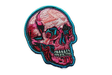 Embroidered human skull patch in pink and blue tones isolated on transparent background. Fashion and customization concept. Design for clothing, accessories, sticker