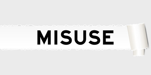 Ripped gray paper background that have word misuse under torn part