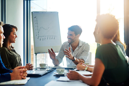 Speaker, presentation and businessman brainstorming to team, planning or training in startup office meeting. Happy group, manager and financial analyst with data, graph or erp statistics for coaching