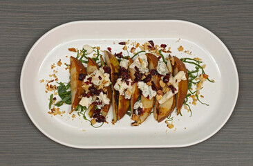 Grilled Pears With Blue Cheese and Walnuts Served at Oval Plate