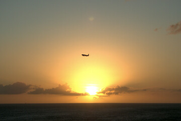 Airplane at the sunset