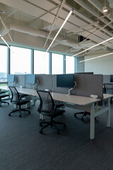 Interior of modern empty office building.Open ceiling design.Equipped with automatic lifting table and LCD screen.