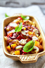 Penne pasta baked with peppers, red onion and mozzarella. 
