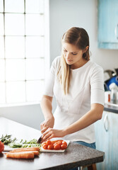 Woman, cooking and cutting in vegetables, kitchen and healthy meal for diet, home and nutrition. Vegetarian, organic and ingredients with food, soup and wellness or dinner, lunch with vitamins