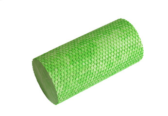 A green massage foam roller isolated on a white background. Close-up. Foam rolling is a self myofascial release technique. Concept of fitness equipment.