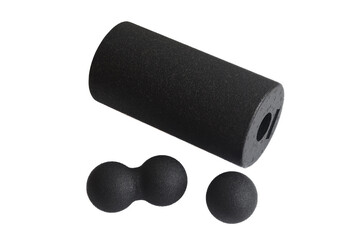 A black massage foam roller and balls for trigger points isolated on a white background. Close-up....