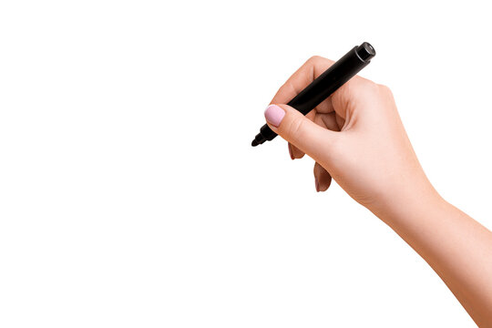 Female hand holding a black marker and about to write on a blank background