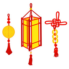 A set of red threads tied in Chinese knots for good luck and a paper lantern. Gold coins, amulet, paper element. Materials in the traditional Asian style are used for decoration in a cultural theme.