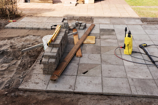 Laying patio tiles in the garden