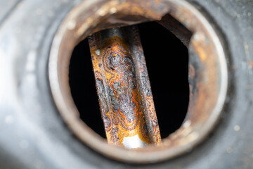 Iron Decay: A Close-Up of Rusty Motorcycle Fuel Tank Interiors: Capturing the Corrosion Inside a...