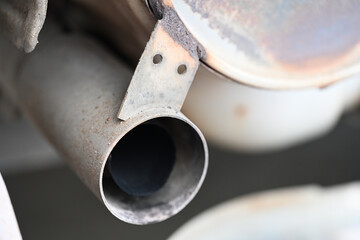 From Rust to Ruin: A Detailed Look at a Rusty Exhaust System: High-Quality Shot of Rusted Exhaust Components