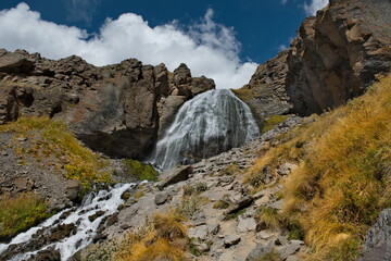 Russia, the North Caucasus. View of the grandiose Chiranbashi-Su waterfall (maiden braids) at an altitude of 2800m at the foot of Mount Elbrus in Kabardino-Balkaria.