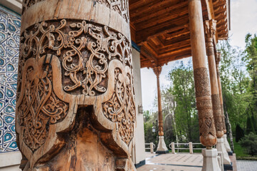 Wooden column with carved oriental pattern Uzbek ornament in the Museum of Victims of Political...