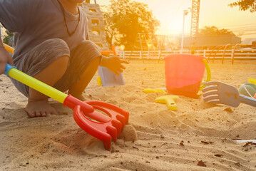 Playing with sand in the playground with hands small hand muscles large muscles of young children...