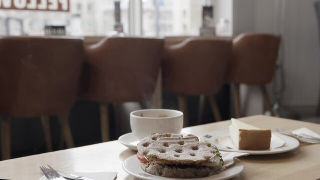 cup of coffee and cookies in a calm coffee shop in a morning