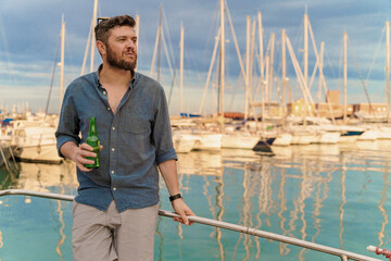 Man Relaxing with Beer on Yacht - Marina Leisure