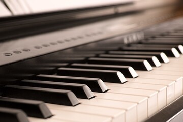 A close-up shot of a digital piano keyboard.
