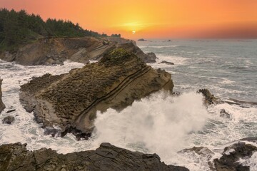 Big waves at Shore Acres State Park at sunset on the Oregon coast.