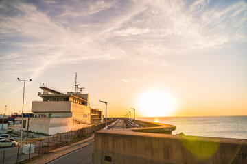 Spanish port at sunset. Industrial buildings in the port.