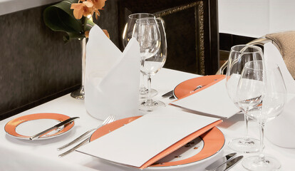 Elegant Fine Dining Table Setting with Orange Accents