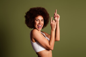 No retouch photo of impressed cute lady underwear accepte pimple skin pointing fingers empty space isolated khaki color background