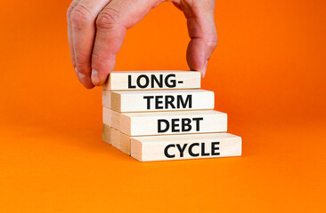 Long-term debt cycle symbol. Concept words Long-term debt cycle on beautiful wooden block....