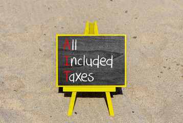AIT All included taxes symbol. Concept words AIT All included taxes on beautiful yellow blackboard....