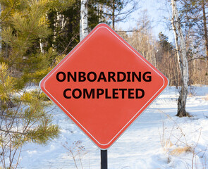 Onboarding completed symbol. Concept words Onboarding completed on beautiful red road sign....