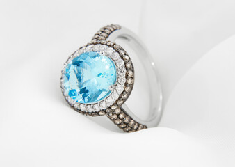 Aquamarine and Diamond White Gold Ring Displayed on Silk.
