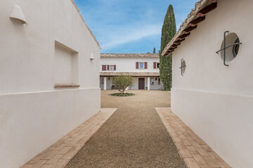 Access hallway from the outside to the interior patio of an Andalusian farmhouse style country house