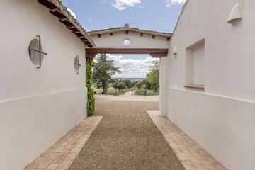 Access hallway from the outside to the interior patio of an Andalusian farmhouse style country...