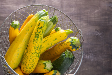 Yellow green leopard spotted zucchini. Vegetables on the table. vegetable marrow harvest. Food...