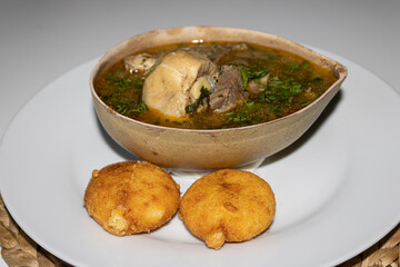 Venezuelan chicken soup and arepas