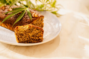 Freshly tasty baked bread with the addition of cannabis, decorated with hemp leaves