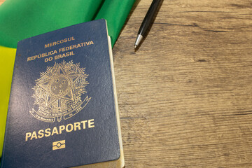 LAURO DE FREITAS, BRAZIL - April 26, 2024 : Brazilian passport next to the Brazilian flag
