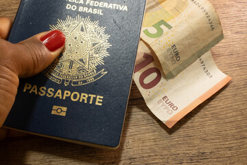 LAURO DE FREITAS, BRAZIL - April 26, 2024 : Brazilian passport with euros on the side