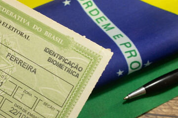 LAURO DE FREITAS, BRAZIL - April 26, 2024 : Brazilian voter registration card next to the Brazilian...