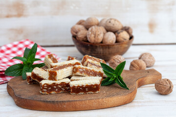 Waffle, Caramel and Walnuts Slices. Homemade waffle cakes. Turkish dessert - Grilijas or grilias.