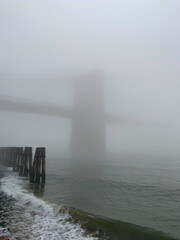 The Brooklyn Bridge as seen in the morning mist